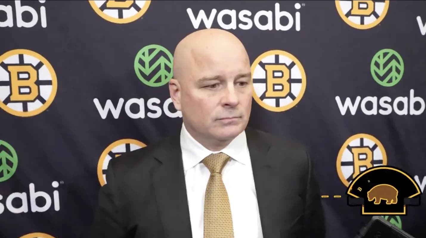 Bruins head coach addressing the media