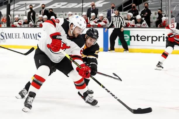 Bruins and Devils players