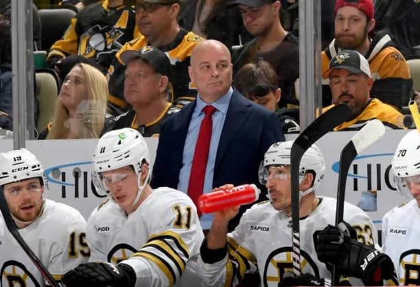 Jim Montgomery behind the Bruins bench