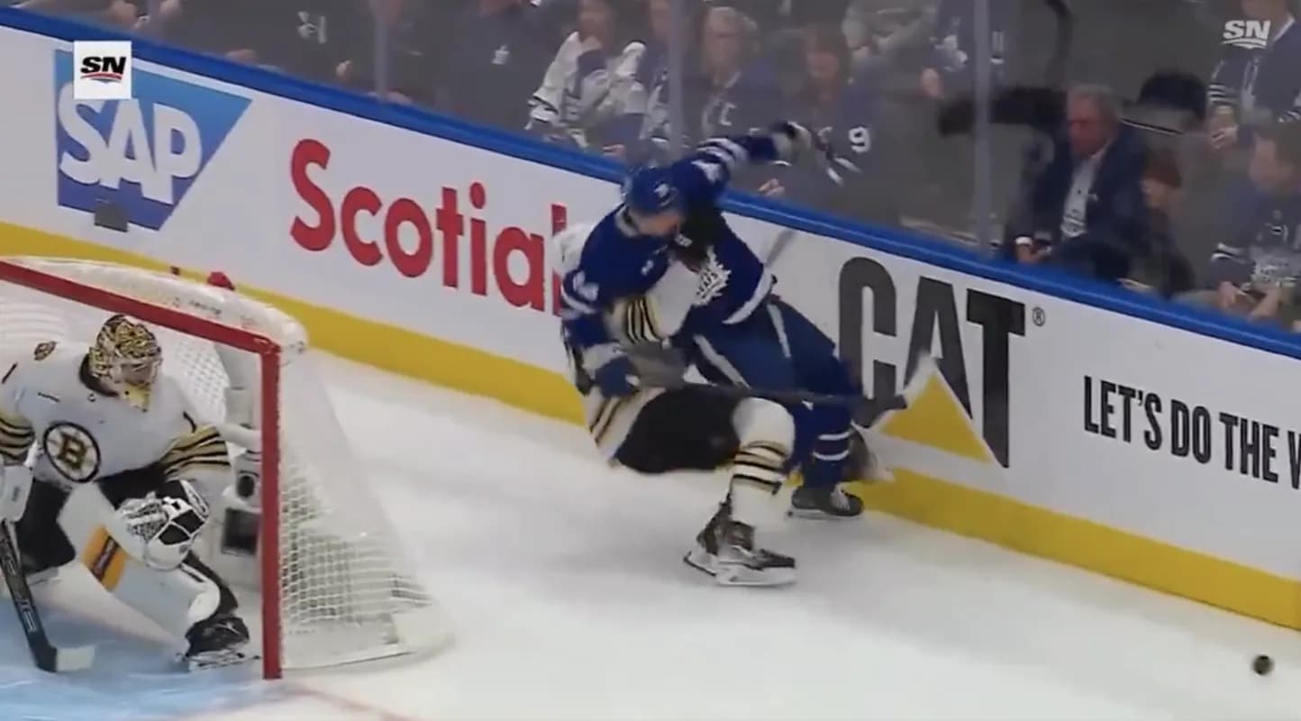 Charlie McAvoy hitting Auston Matthews