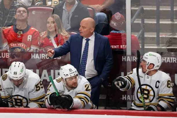 Jim Montgomery behind Bruins bench