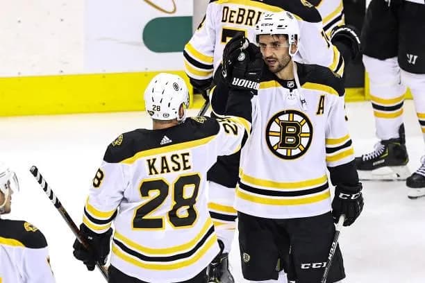 Ondrej Kase and Patrice Bergeron