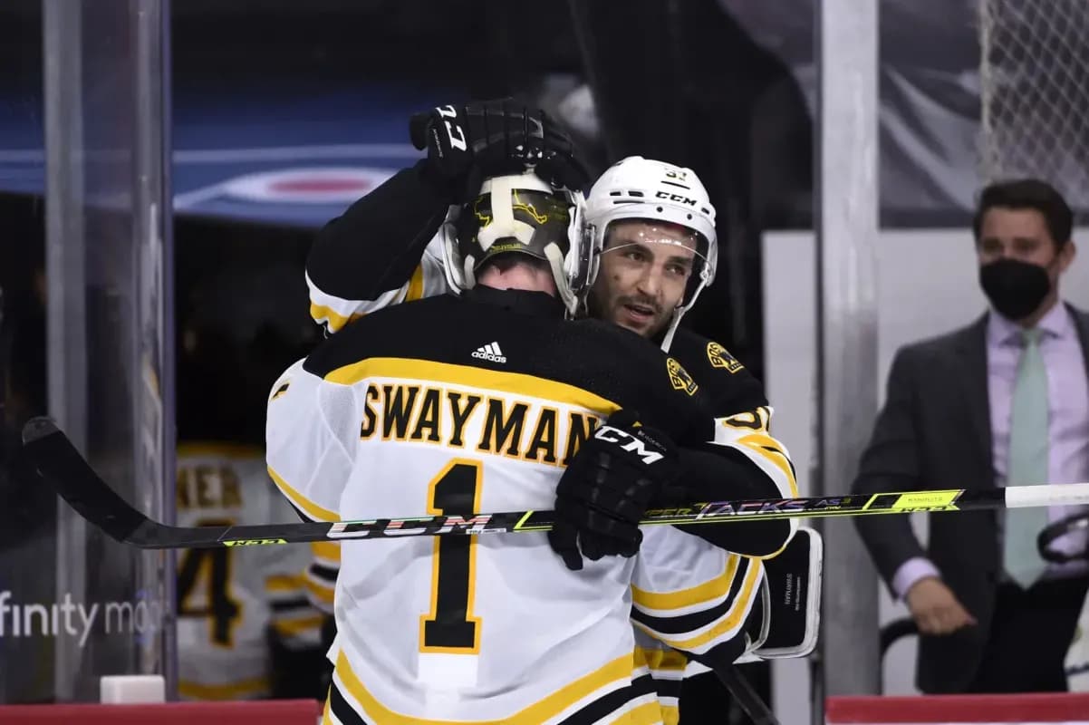 Jeremy Swayman and Patrice Bergeron