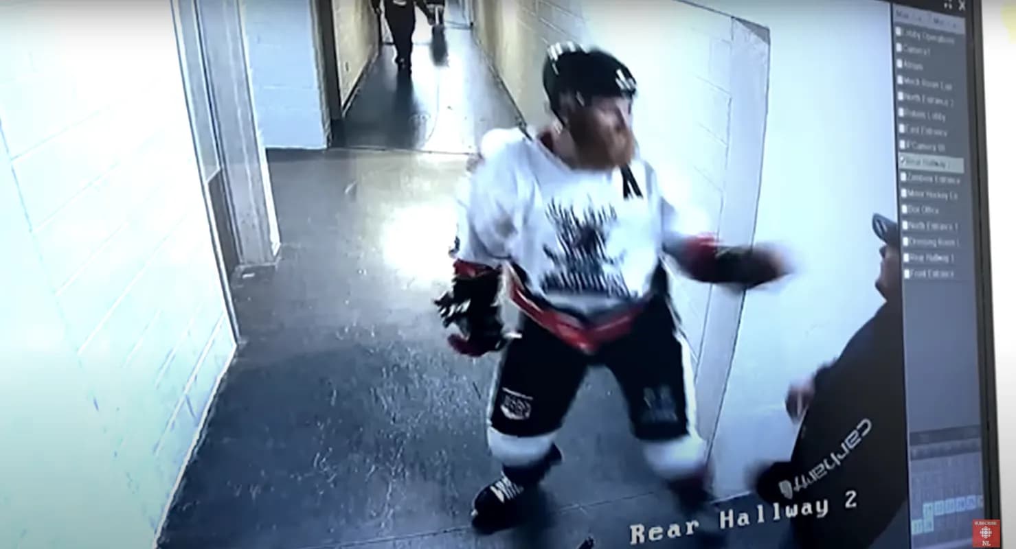 Justin Pender fighting a fan outside of the locker room