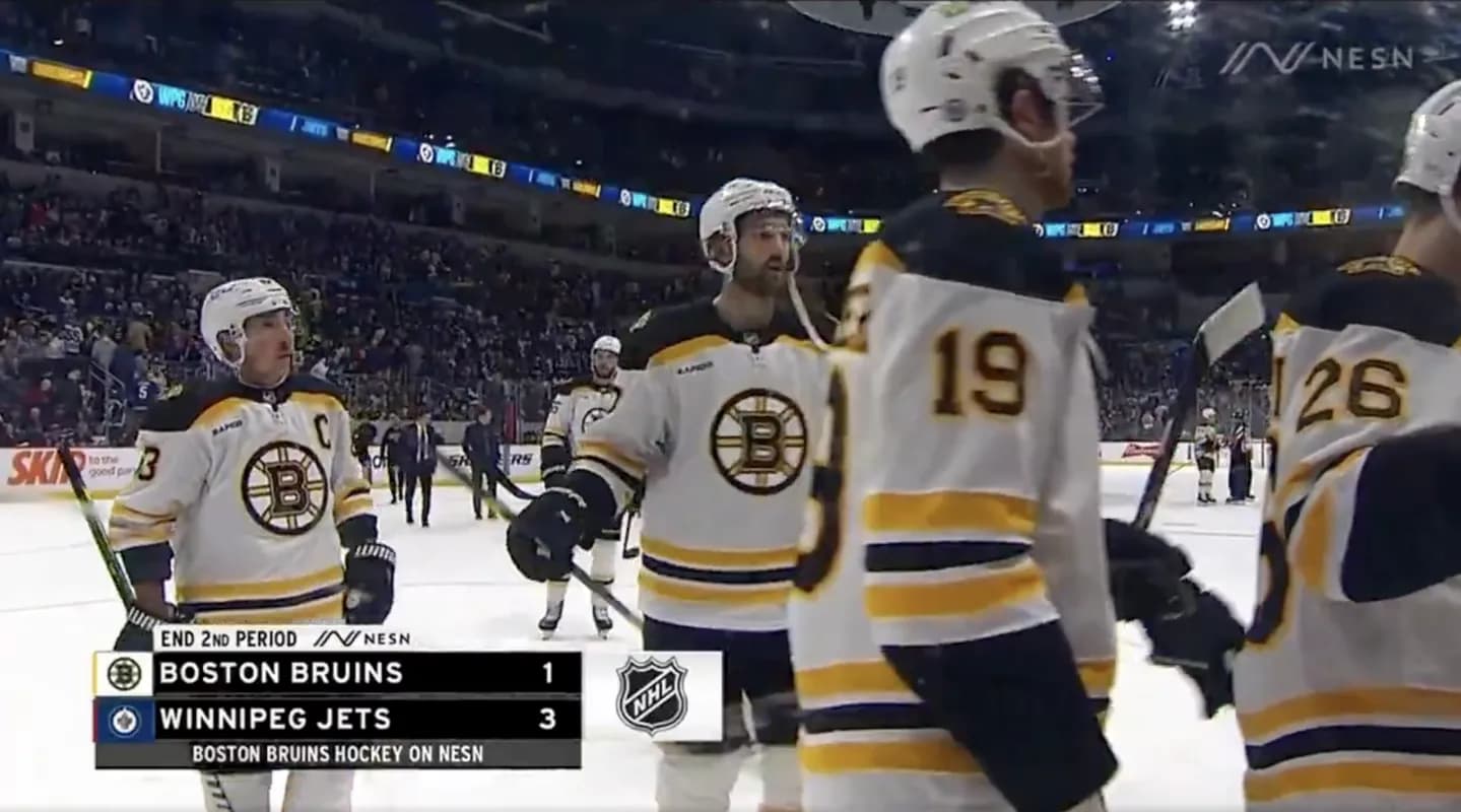 Bruins players leaving the ice