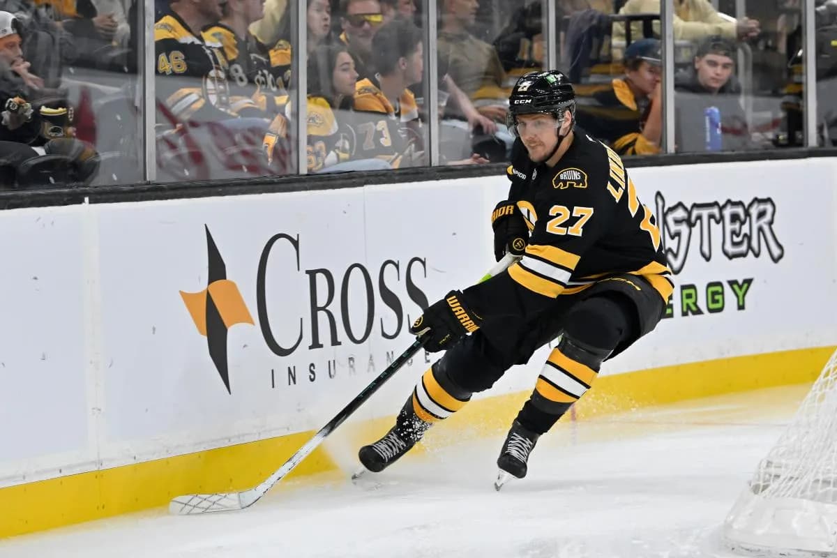 Boston Bruins defenseman Hampus Lindholm (27) shields the puck during the second period against the Philadelphia Flyers at TD Garden.