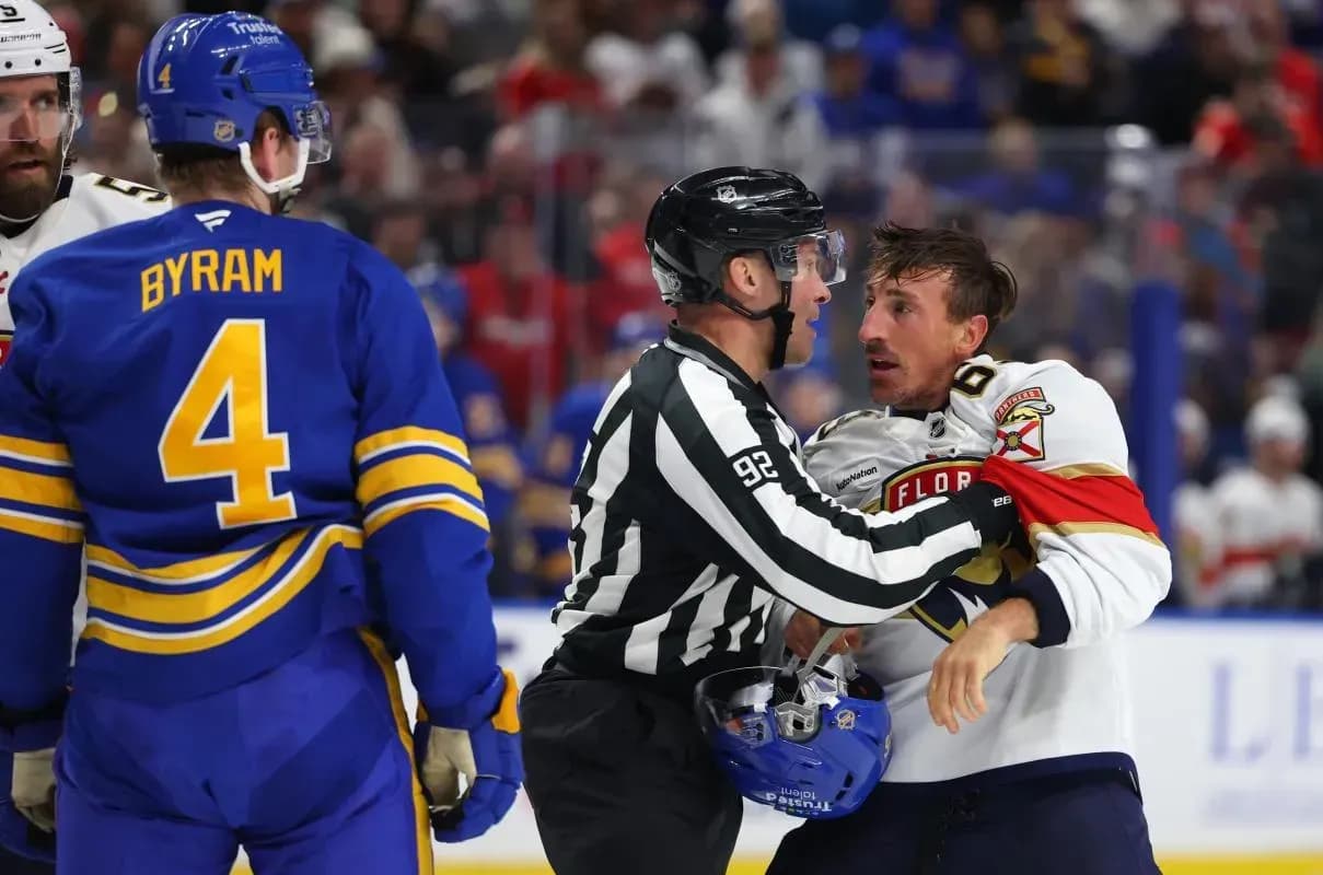 Florida Panthers left wing Brad Marchand (63) gets held back by the linesman during the second period against the Buffalo Sabres at KeyBank Center.