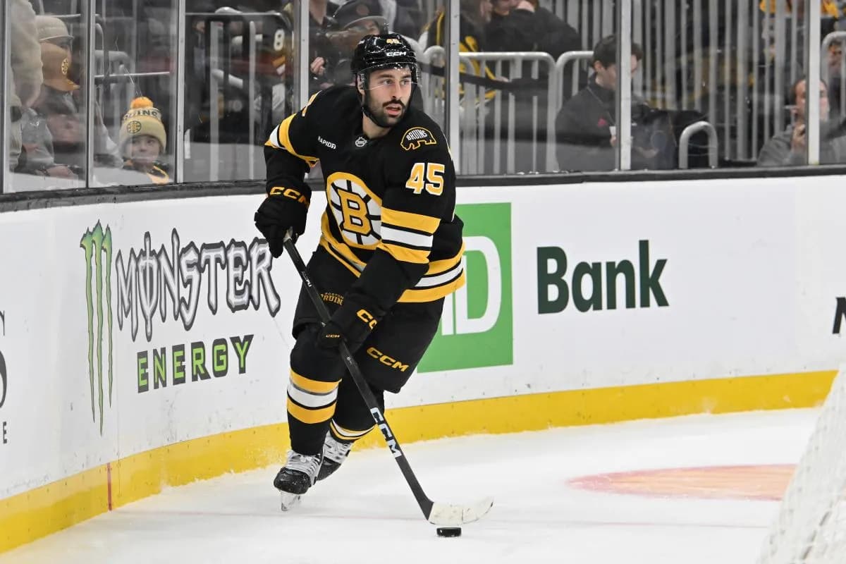Boston Bruins defenseman Jonathan Aspirot (45) skates with the puck during the second period against the Carolina Hurricanes at TD Garden.
