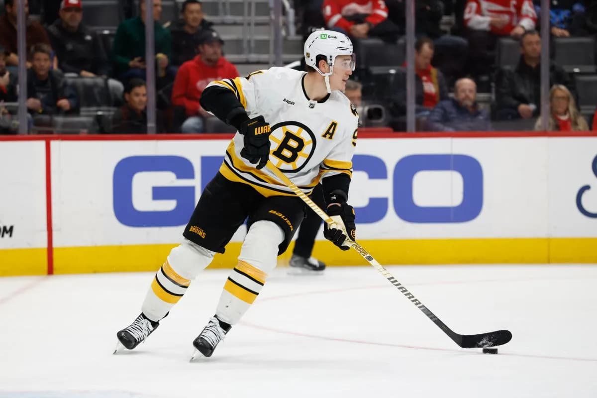 Boston Bruins defenseman Nikita Zadorov (91) skates with the puck in the second period against the Detroit Red Wings at Little Caesars Arena.