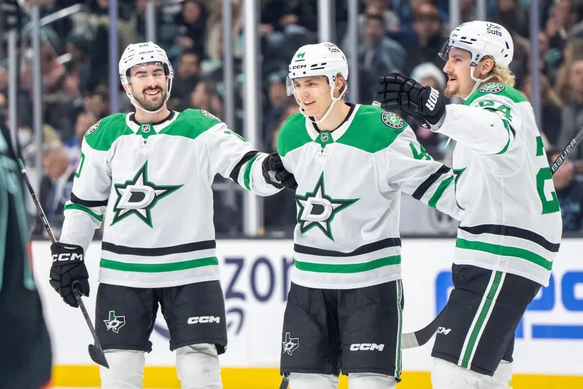 Dallas Stars, from left, defenseman Kyle Capobianco (20), defenseman Vladislav Kolyachonok (44) and forward Roope Hintz (24) celebrate a goal during the third period at Climate Pledge Arena.