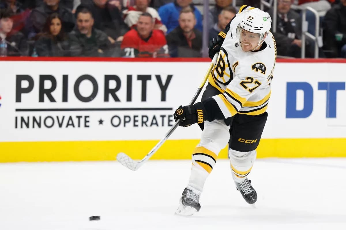 Boston Bruins defenseman Hampus Lindholm (27) takes a shot in the third period against the Detroit Red Wings at Little Caesars Arena.