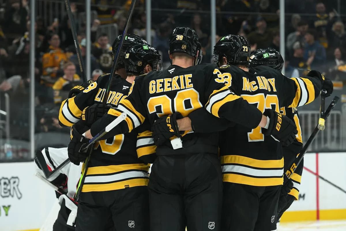 Boston Bruins center Morgan Geekie (39) celebrates a goal by center Elias Lindholm (28) with his linemates during the third period against the Chicago Blackhawks at TD Garden.