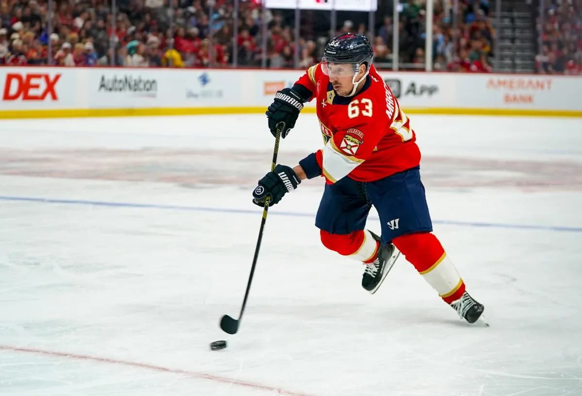 Florida Panthers left wing Brad Marchand (63) skates the puck against the Washington Capitals during the third period at Amerant Bank Arena.