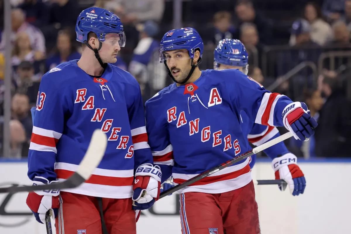 New York Rangers center Vincent Trocheck (16) talks to left wing Alexis Lafreniere (13) during the first period against the Nashville Predators at Madison Square Garden.