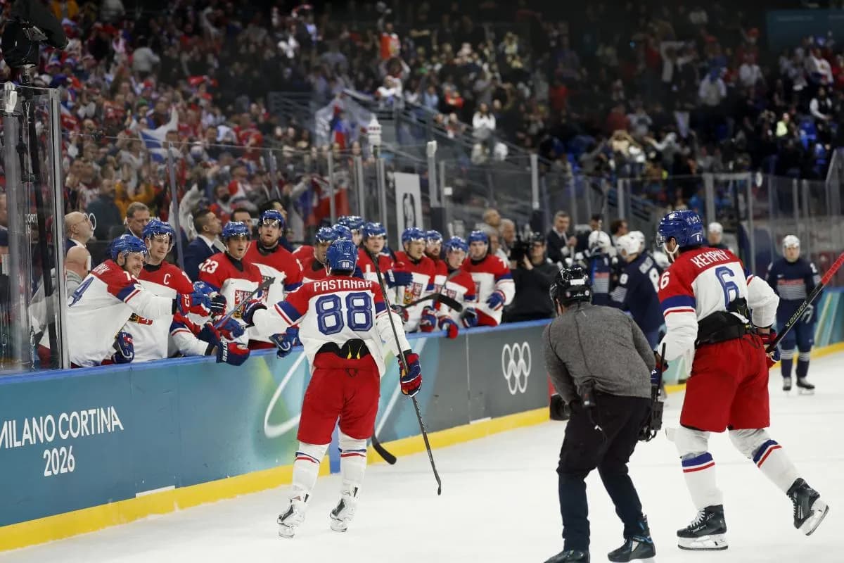 David Pastrnak of Czech Republic celebrates scoring their third goal with teammates against France in men's ice hockey group A play during the Milano Cortina 2026 Olympic Winter Games at Milano Santagiulia Ice Hockey Arena.