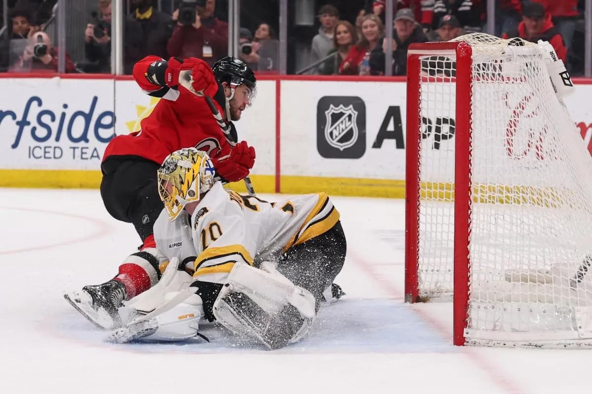 New Jersey Devils left wing Paul Cotter (47) scores the game winning goal on Boston Bruins goaltender Joonas Korpisalo (70) during overtime at Prudential Center.