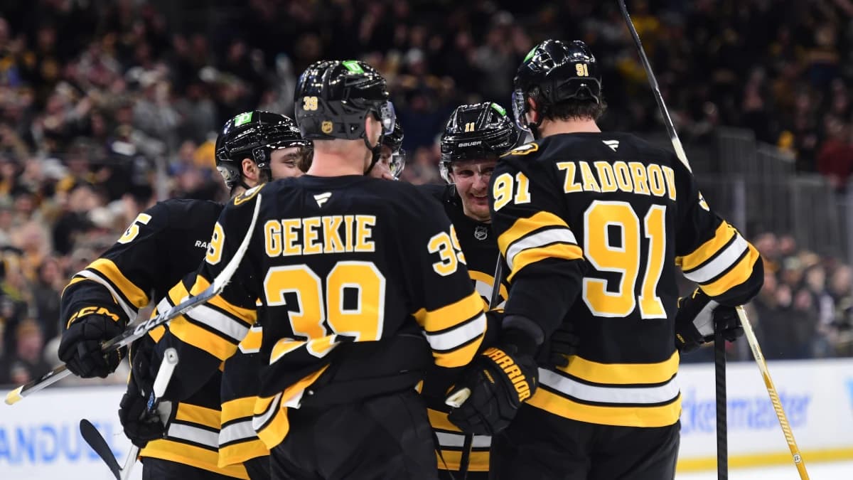 Boston Bruins center Morgan Geekie (39), defenseman Nikita Zadorov (91), center Casey Mittelstadt (11) and defenseman Jonathan Aspirot (45) celebrate a goal by center Pavel Zacha (18) during the third period against the Minnesota Wild at TD Garden.