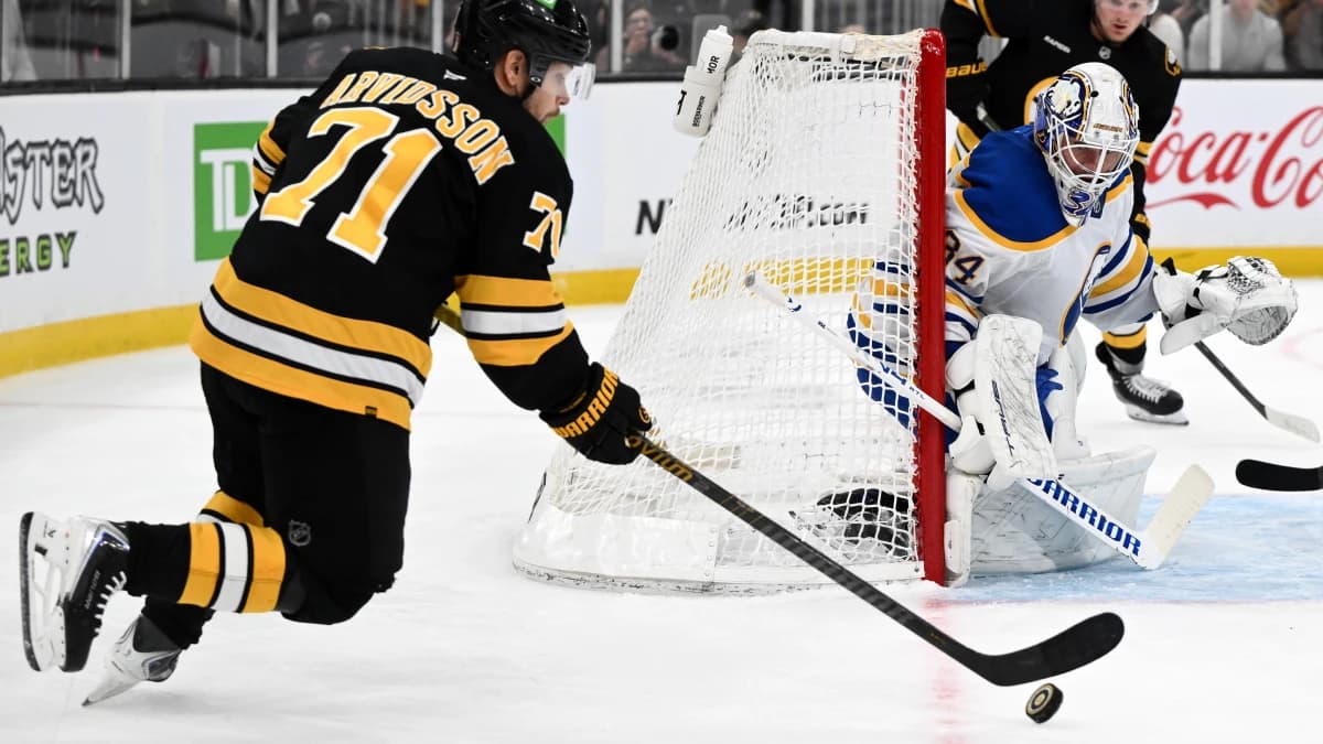 Boston Bruins left wing Viktor Arvidsson (71) attempts a shot on Buffalo Sabres goaltender Alex Lyon (34) during the first period of game three of the first round of the 2026 Stanley Cup Playoffs at the TD Garden.