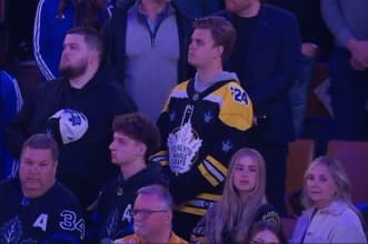 Fan wearing a Boston Bruins and Toronto Maple Leafs jersey
