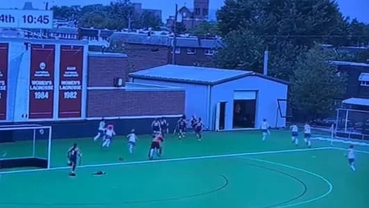 Players running off a hockey field
