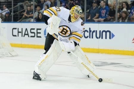 Boston Bruins goaltender Joonas Korpisalo (70) plays the puck during overtime of a preseason game against the New York Rangers at Madison Square Garden.