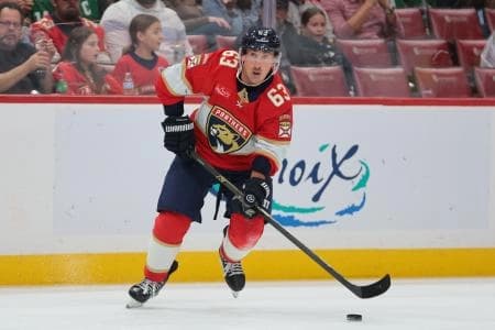 Florida Panthers left wing Brad Marchand (63) moves the puck against the Dallas Stars during the second period at Amerant Bank Arena.