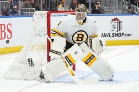 Boston Bruins goaltender Jeremy Swayman (1) defends the net in the second period against the New York Islanders at UBS Arena.