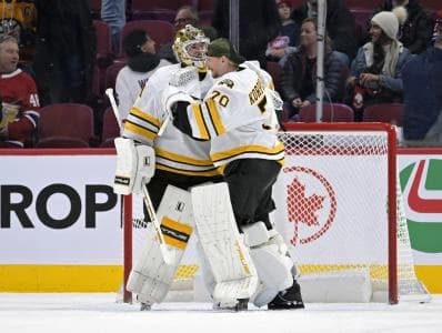 Boston Bruins goalie Jeremy Swayman (1) and teammate goalie Joonas Korpisalo (70) celebrates the win against the Montreal Canadiens at the Bell Centre.