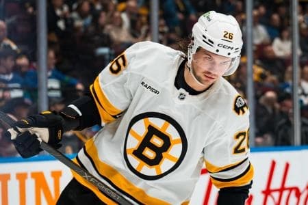 Boston Bruins defenseman Andrew Peeke (26) skates against the Vancouver Canucks in the second period at Rogers Arena.