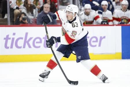 Florida Panthers left wing Brad Marchand (63) shoots the puck against the Chicago Blackhawks during the second period at United Center.