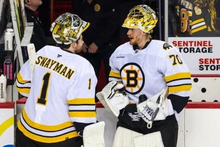 Boston Bruins goaltender Jeremy Swayman (1) and goaltender Joonas Korpisalo (70) during the warmup period against the Calgary Flames at Scotiabank Saddledome.
