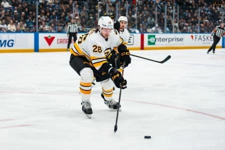 Boston Bruins defenseman Andrew Peeke (26) handles the puck against the Vancouver Canucks in the second period at Rogers Arena.