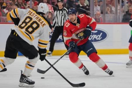 Florida Panthers center Sam Reinhart (13) moves the puck against the Boston Bruins during the second period at Amerant Bank Arena.