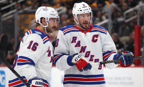 New York Rangers center Vincent Trocheck (16) and center J.T. Miller (right) talk on the ice against the Pittsburgh Penguins during the second period at PPG Paints Arena.