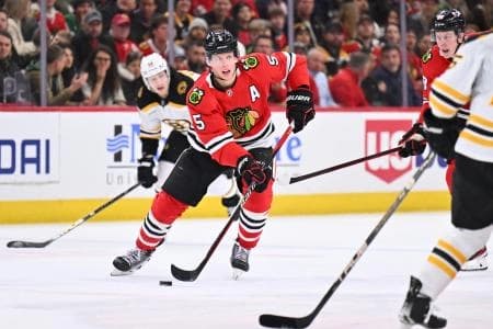 Chicago Blackhawks defenseman Connor Murphy (5) skates the puck up the ice in the first period against the Boston Bruins at United Center.