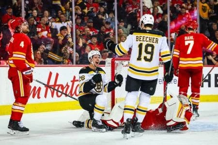 Boston Bruins center Marc McLaughlin (26) celebrates his goal against Calgary Flames goaltender Dustin Wolf (32) during the third period at Scotiabank Saddledome.