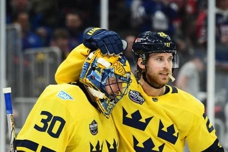 [Imagn Images direct customers only] Team Sweden forward Elias Lindholm (28) congratulates goalie Samuel Ersson (30) after defeating Team USA during a 4 Nations Face-Off ice hockey game at TD Garden.