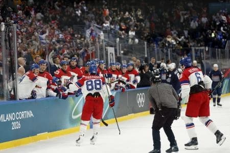David Pastrnak of Czech Republic celebrates scoring their third goal with teammates against France in men's ice hockey group A play during the Milano Cortina 2026 Olympic Winter Games at Milano Santagiulia Ice Hockey Arena.
