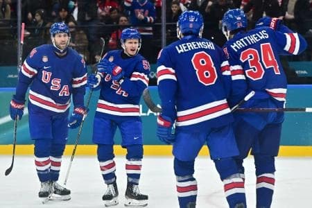 Jake Guentzel of United States celebrates scoring their fifth goal with teammates against Denmark in men's ice hockey group C play during the Milano Cortina 2026 Olympic Winter Games at Milano Santagiulia Ice Hockey Arena.