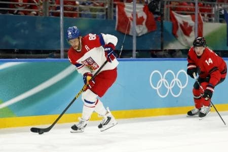 David Pastrnak of Czechia controls the puck against Canada in a men's ice hockey quarterfinal during the Milano Cortina 2026 Olympic Winter Games at Milano Santagiulia Ice Hockey Arena.