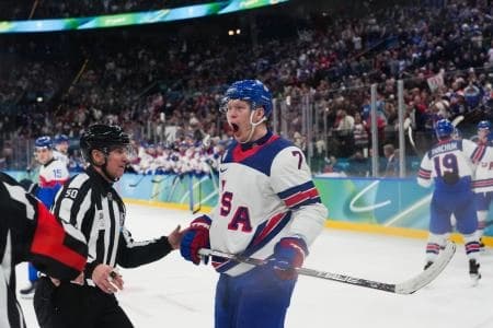 Brady Tkachuk (7) of the United States celebrates a goal scored by Jack Eichel (not pictured) of the United States during the second period against Slovakia in a men's ice hockey semifinal during the Milano Cortina 2026 Olympic Winter Games at Milano Santagiulia Ice Hockey Arena.