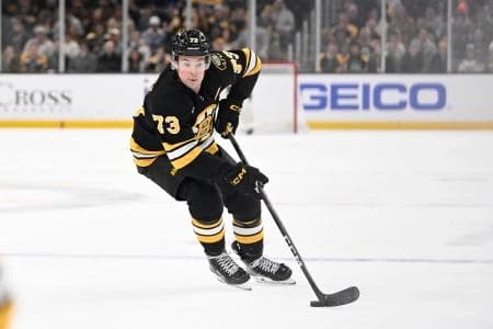 Boston Bruins defenseman Charlie McAvoy (73) settles the puck during the first period against the Columbus Blue Jackets at TD Garden.