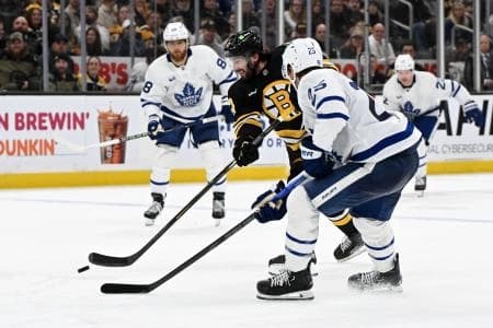 Boston Bruins center Mark Kastelic (47) controls the puck against Toronto Maple Leafs defenseman Brandon Carlo (25) during the third period at the TD Garden.