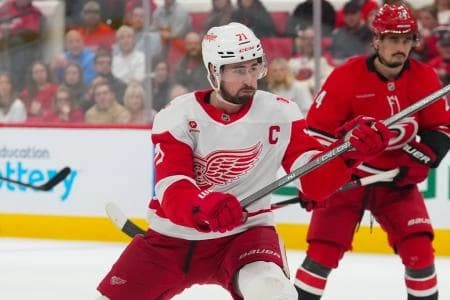 Detroit Red Wings center Dylan Larkin (71) takes a shot against the Carolina Hurricanes during the second period at Lenovo Center.