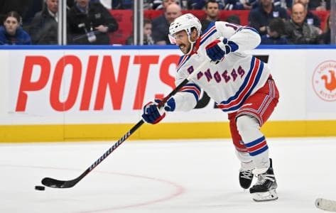 New York Rangers forward Vincent Trochek (16) shoots the puck against the Toronto Maple Leafs in overtime at Scotiabank Arena.