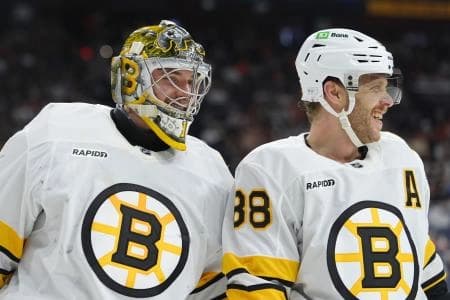 Boston Bruins goalie Jeremy Swayman (1) reacts with right wing David Pastrnak (88) against the Philadelphia Flyers in the second period at Xfinity Mobile Arena