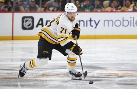 Boston Bruins left wing Viktor Arvidsson (71) skates up ice with the puck against the Pittsburgh Penguins during the third period at PPG Paints Arena