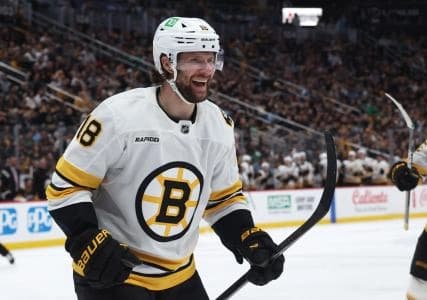 Boston Bruins center Pavel Zacha (18) reacts after scoring his third goal of the game to complete a hat trick against the Pittsburgh Penguins during the third period at PPG Paints Arena.