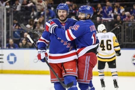 New York Rangers centers J.T. Miller (8) and Vincent Trocheck (16) celebrate in the second period against the Pittsburgh Penguins at Madison Square Garden