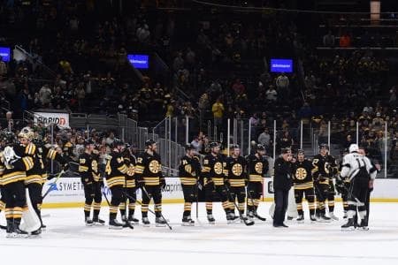 Los Angeles Kings center Anze Kopitar (11) is greeted by the Boston Bruins after playing his last game at TD Garden.